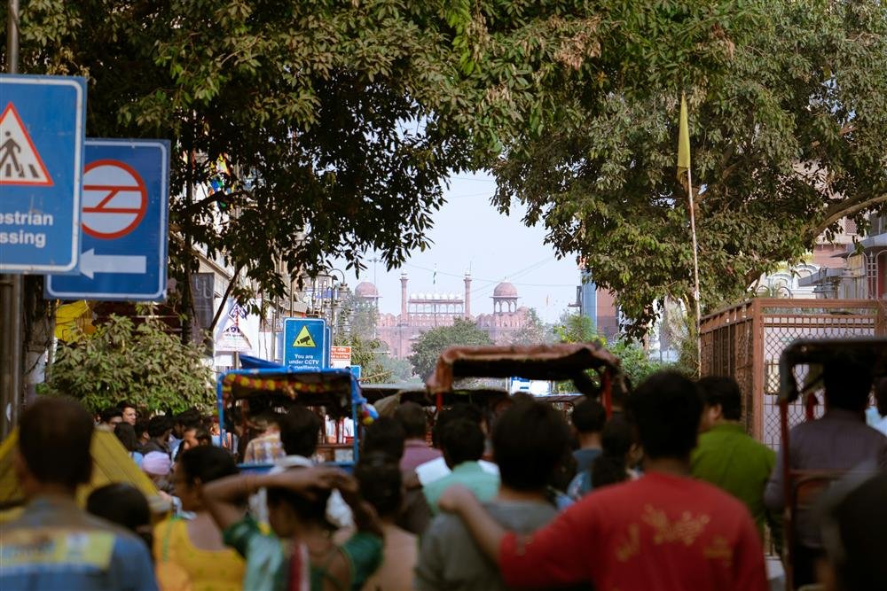Crowded Chandni Chowk market lane in Old Delhi